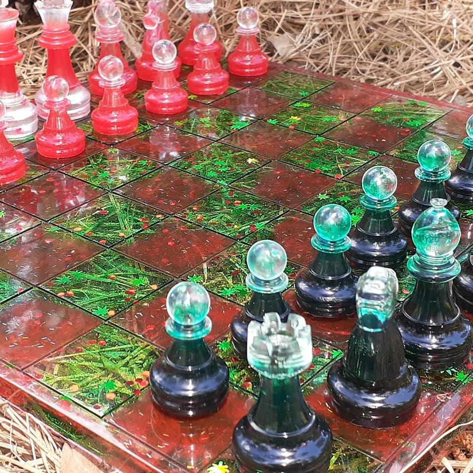 A custom resin chess set made by RV Mom in Pink